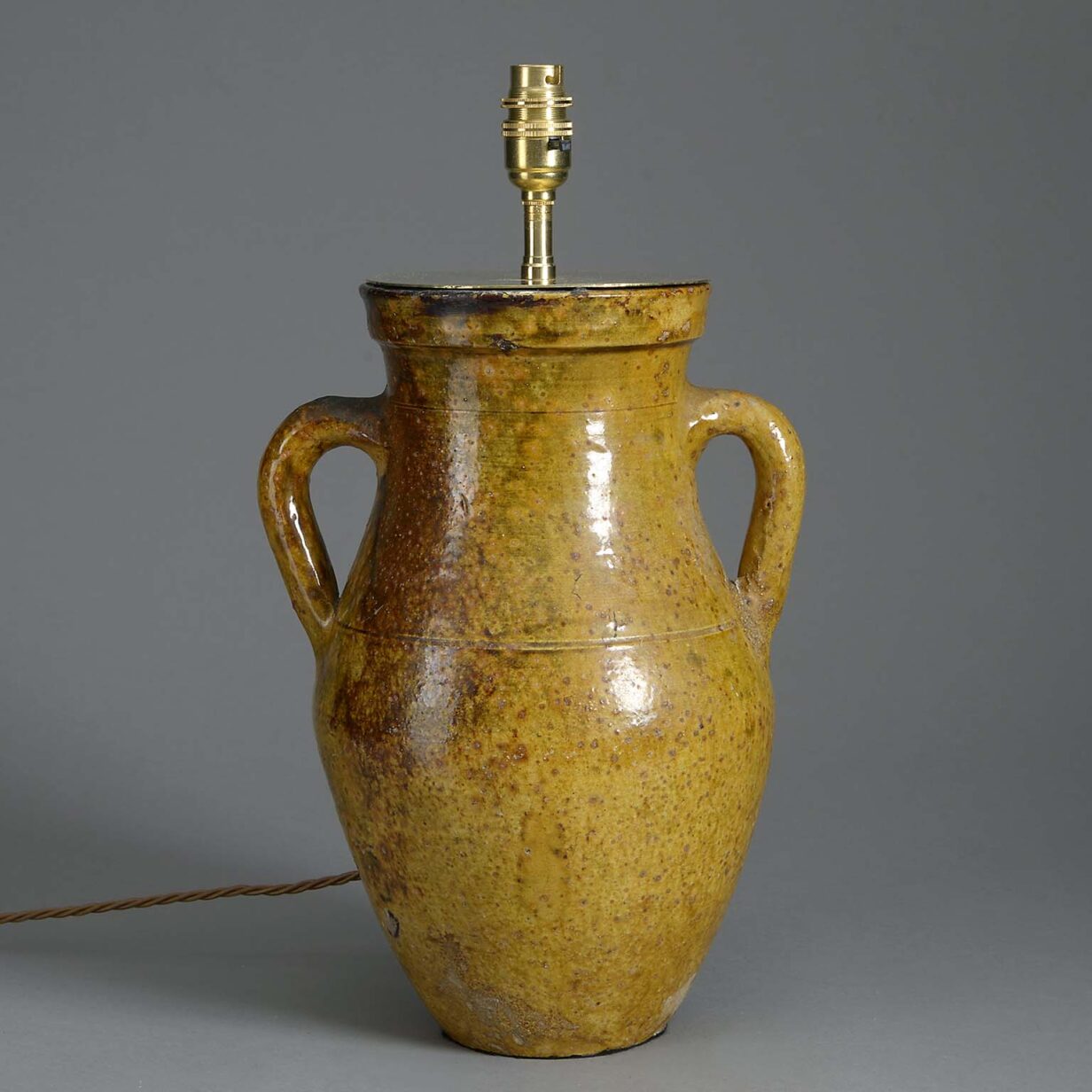 Ochre glazed pottery jar lamp