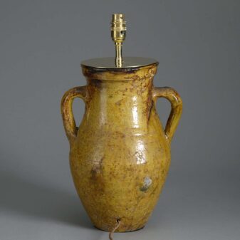 Ochre glazed pottery jar lamp