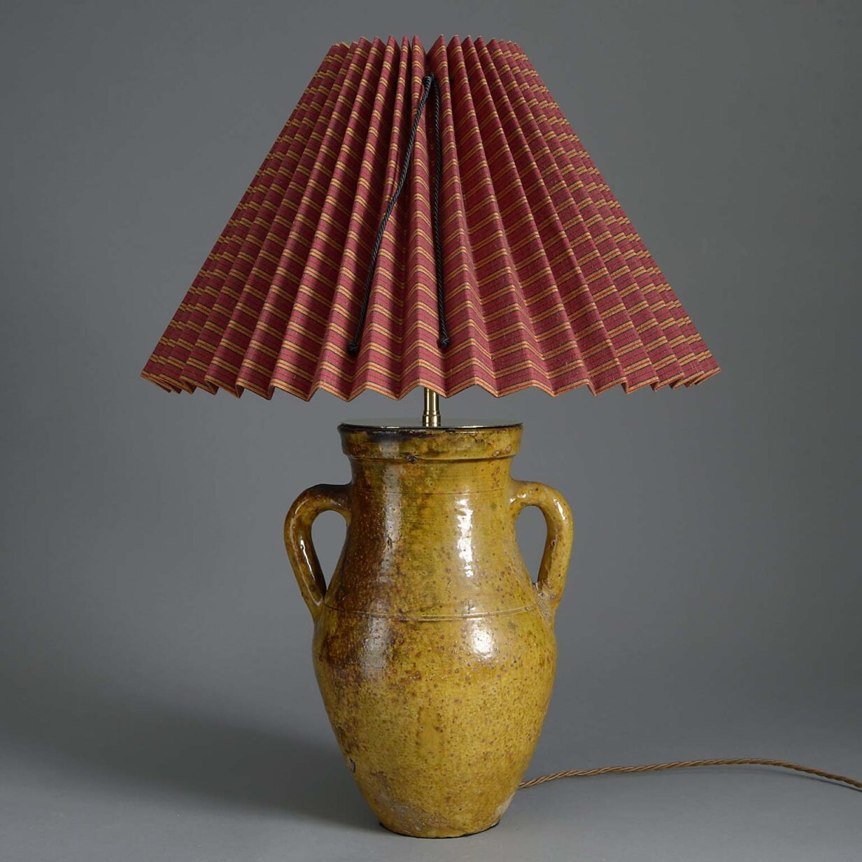 Ochre glazed pottery jar lamp