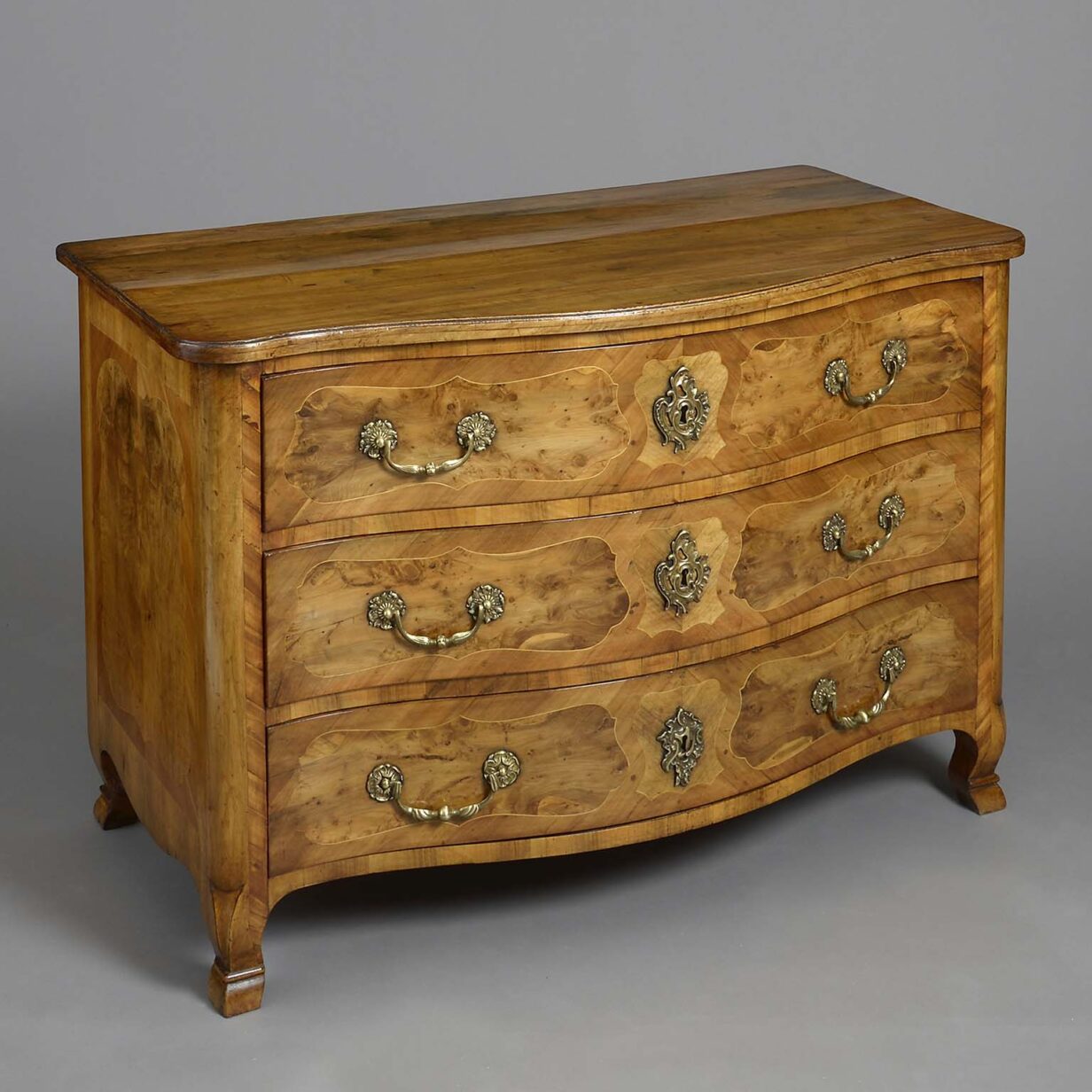 Mid-18th century louis xv period serpentine walnut commode