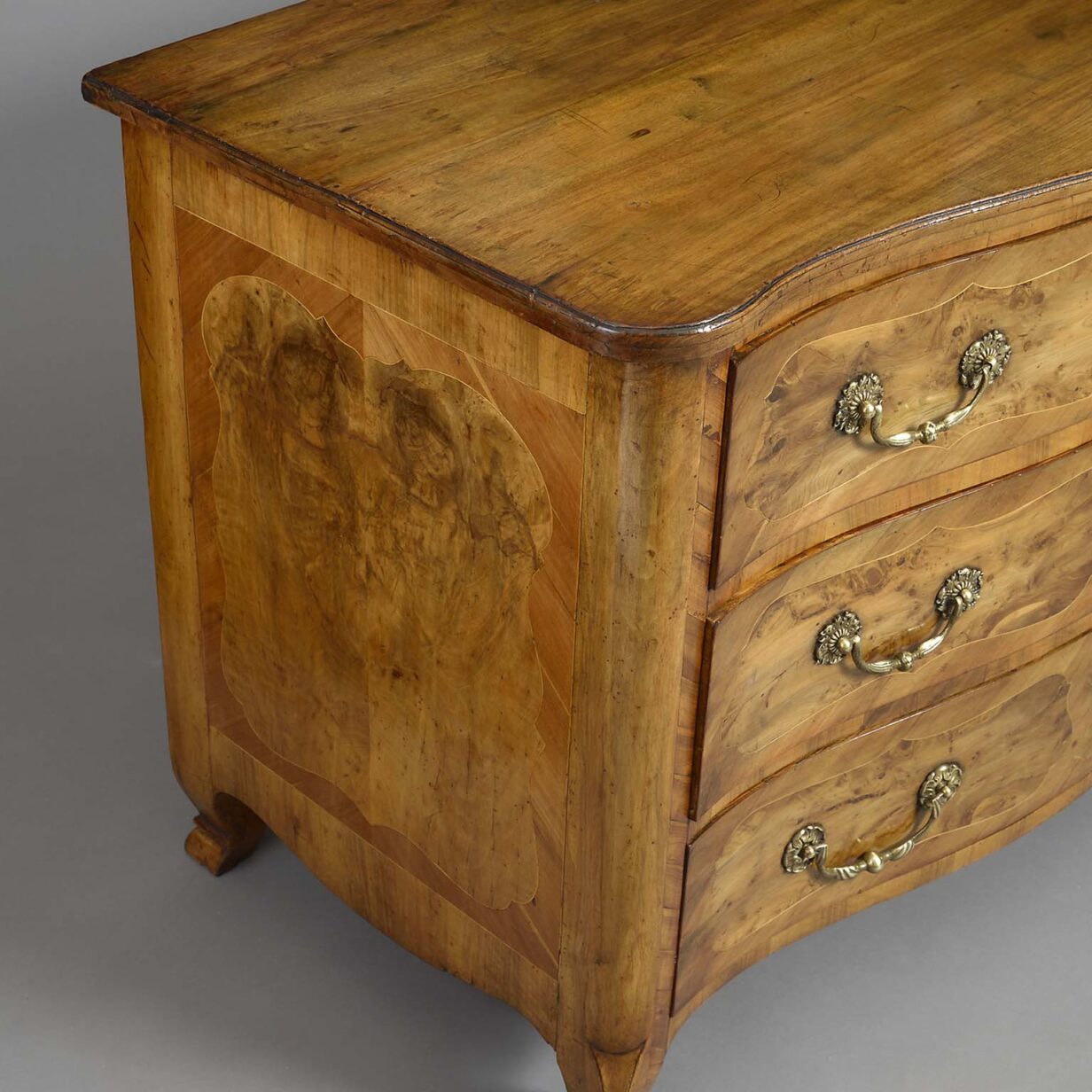 Mid-18th century louis xv period serpentine walnut commode