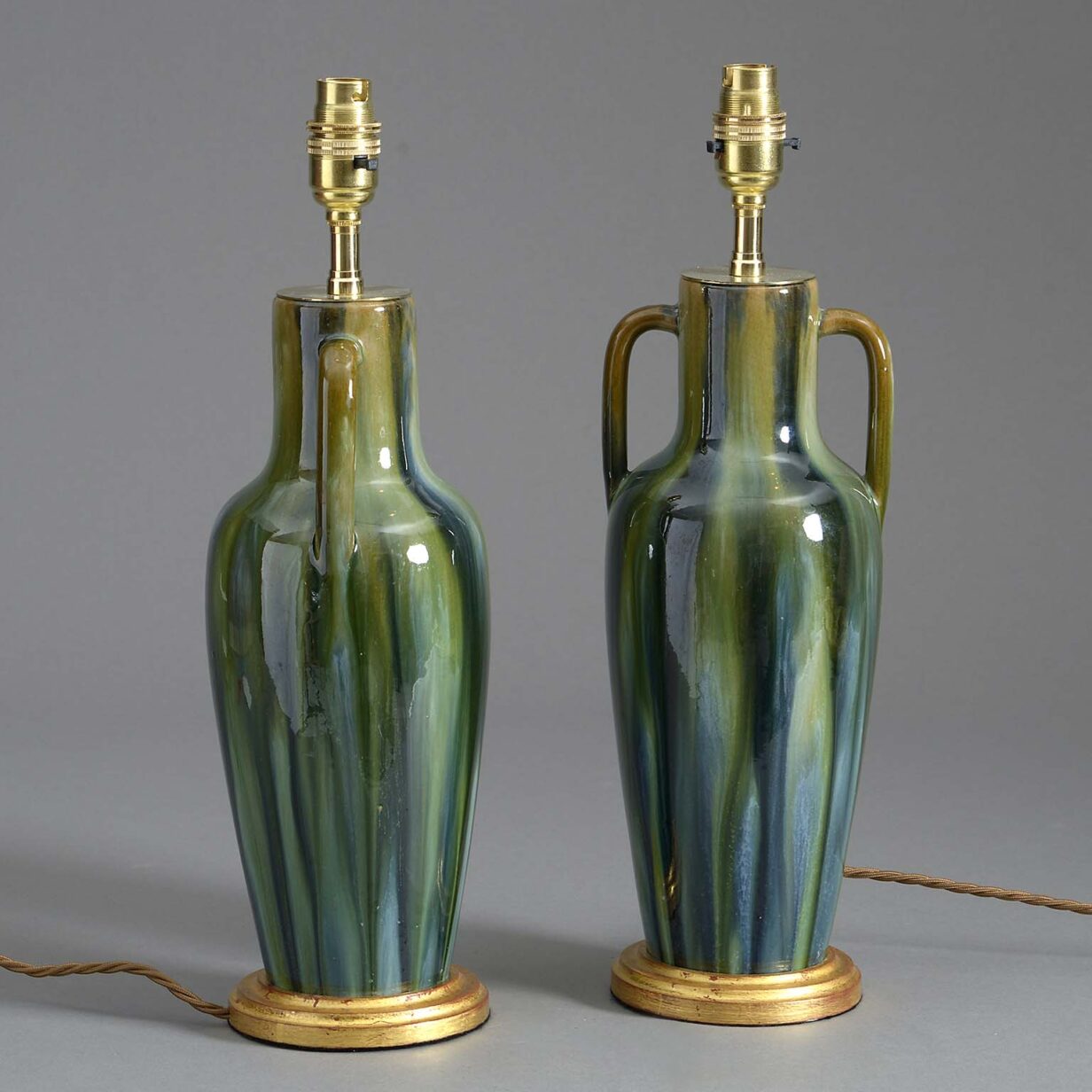 Pair of early 20th century slop glazed vase lamps