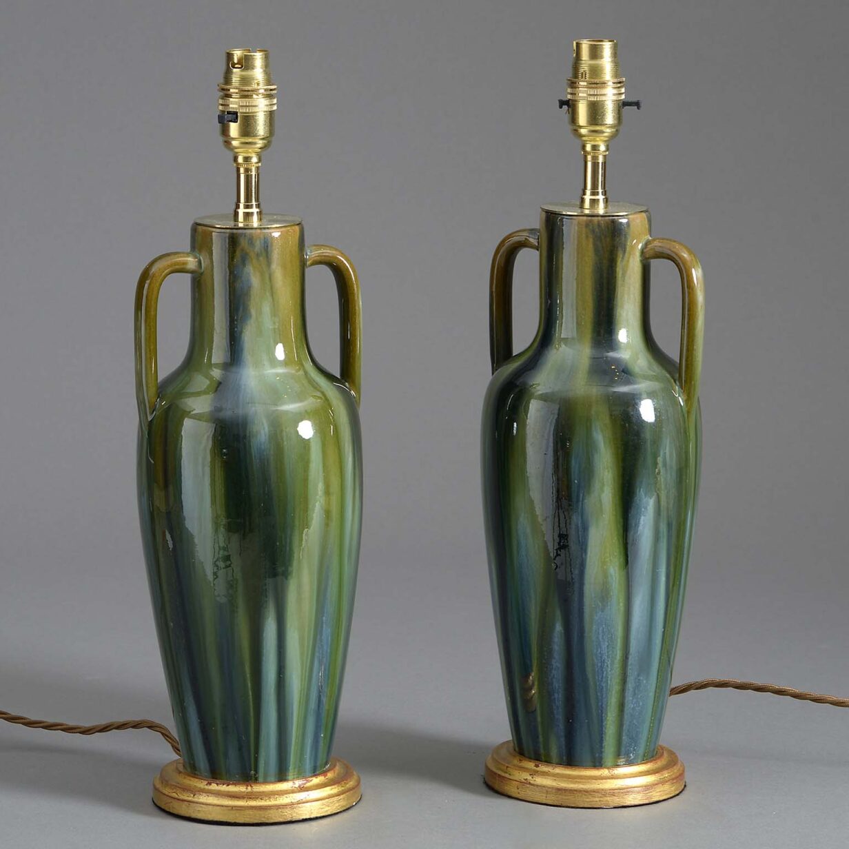 Pair of early 20th century slop glazed vase lamps