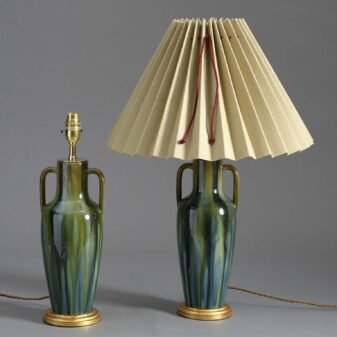 Pair of antique slop glazed pottery lamps