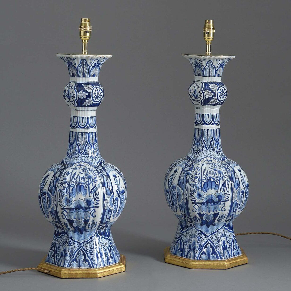 Pair of late 19th century blue & white glazed delft vase lamps