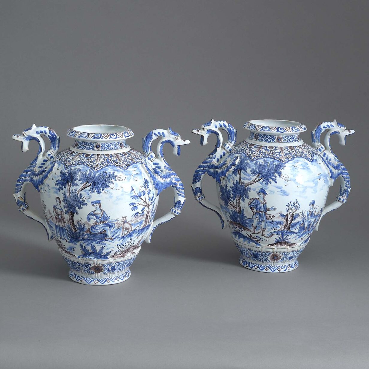 Pair of antique blue, white, manganese pottery vases